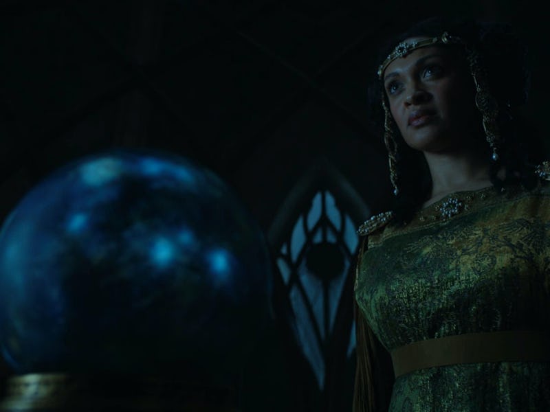 Míriel (Cynthia Addai-Robinson) stands in front of a palantír in The Lord of the Rings: The Rings of...