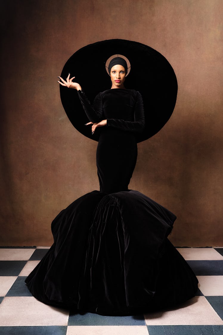 Model posing in a black gown Harris Reed creation