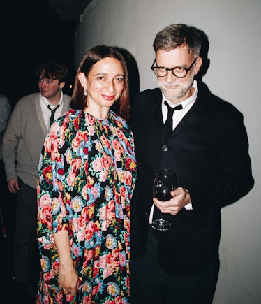 Maya Rudolph and Paul Thomas Anderson hugging for a photo at the 2022 Best Performances party 