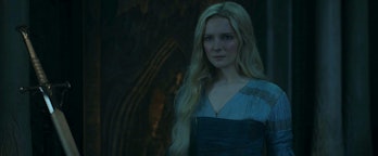 Galadriel (Morfydd Clark) stands next to a very familiar looking sword in The Lord of the Rings: The...