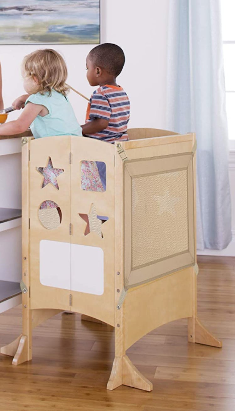 Two toddlers in wide toddler learning tower