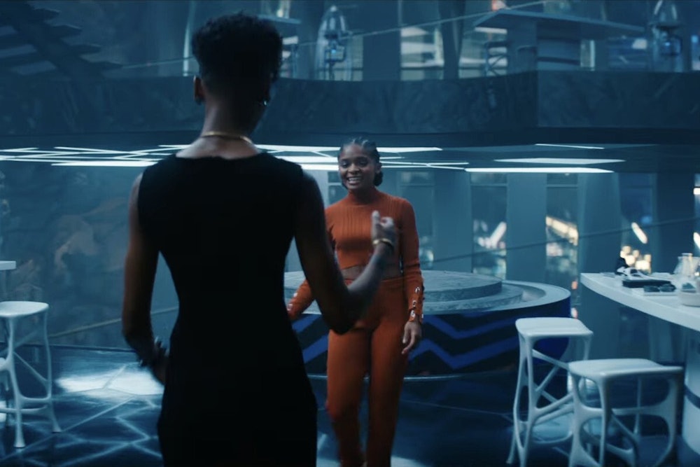 Shuri (Letitia Wright) greeting Riri (Dominique Thorne) in Black Panther: Wakanda Forever.