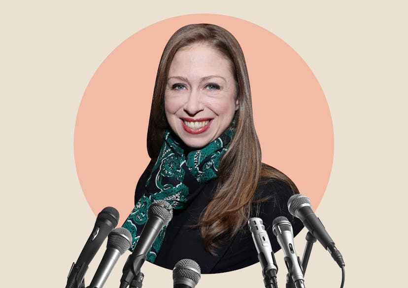 Chelsea Clinton on an orange background with microphones in front of her 