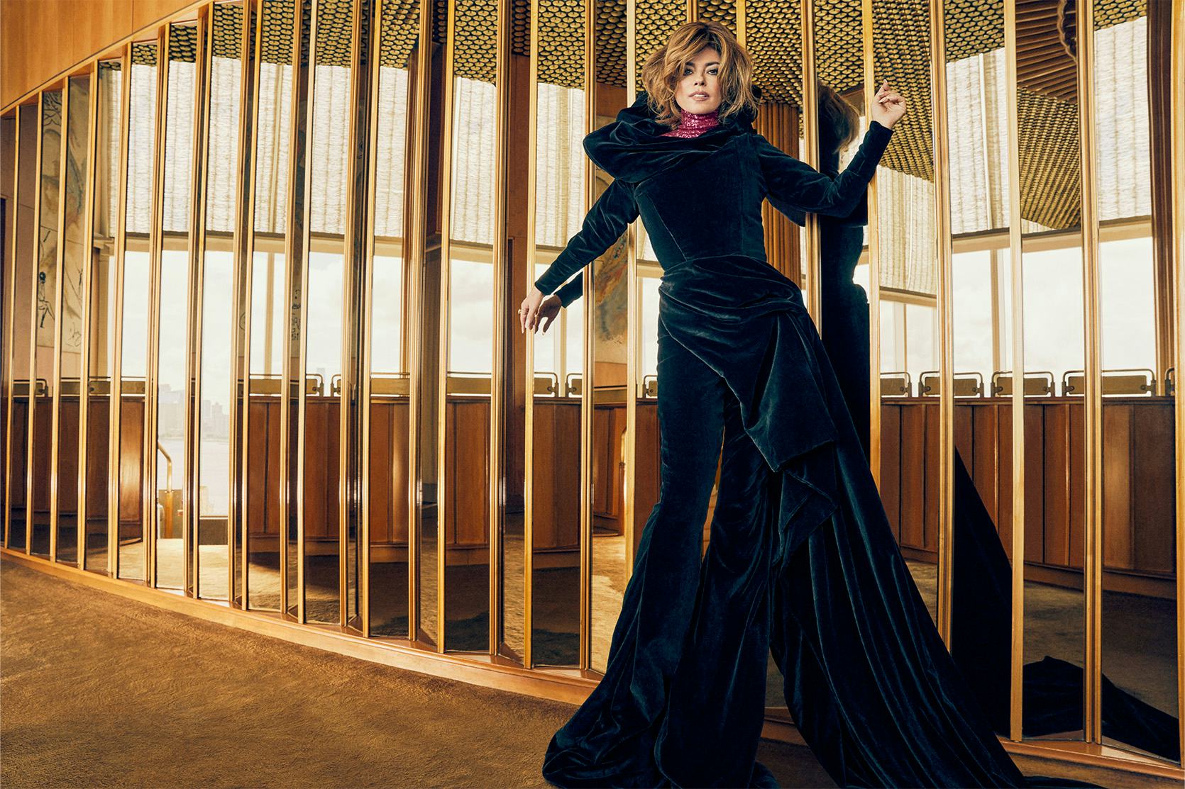 Shania Twain posing in a black Harris Reed jumpsuit