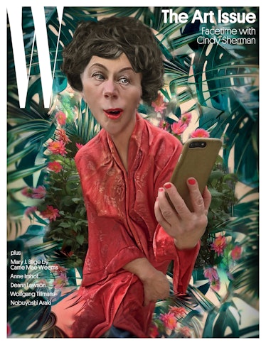 A distorted image of Cindy Sherman in a red dress, holding a smartphone