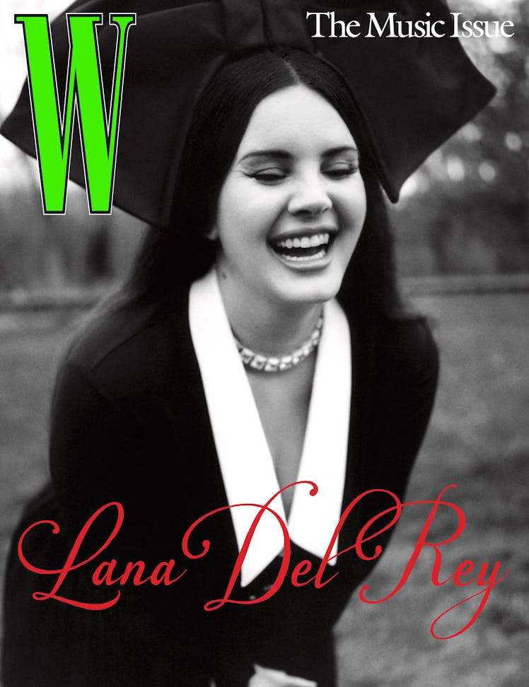 Lana Del Rey laughing on the cover of W Magazine in a black-and-white image