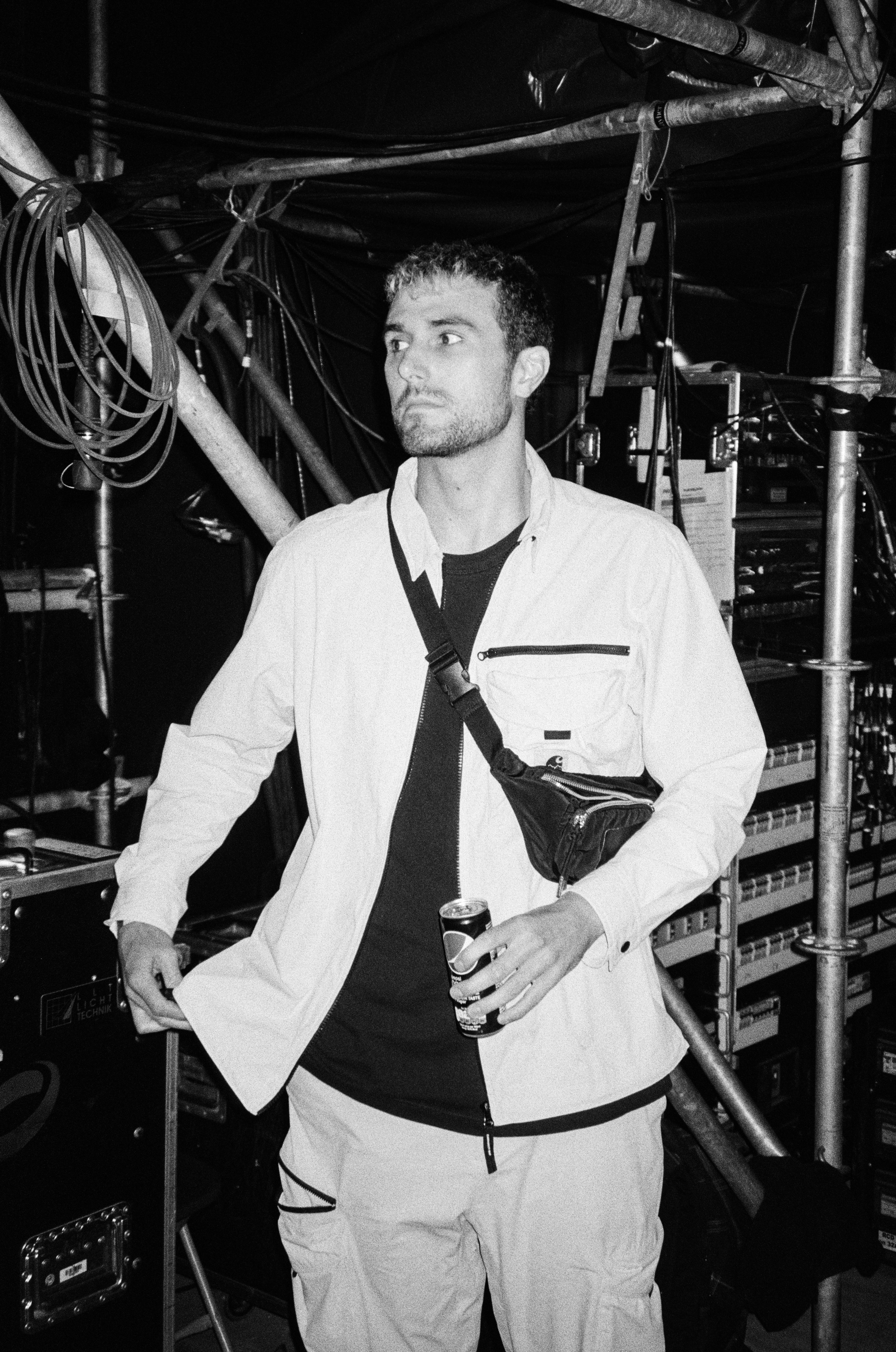 Fred Again backstage at a show in black and white