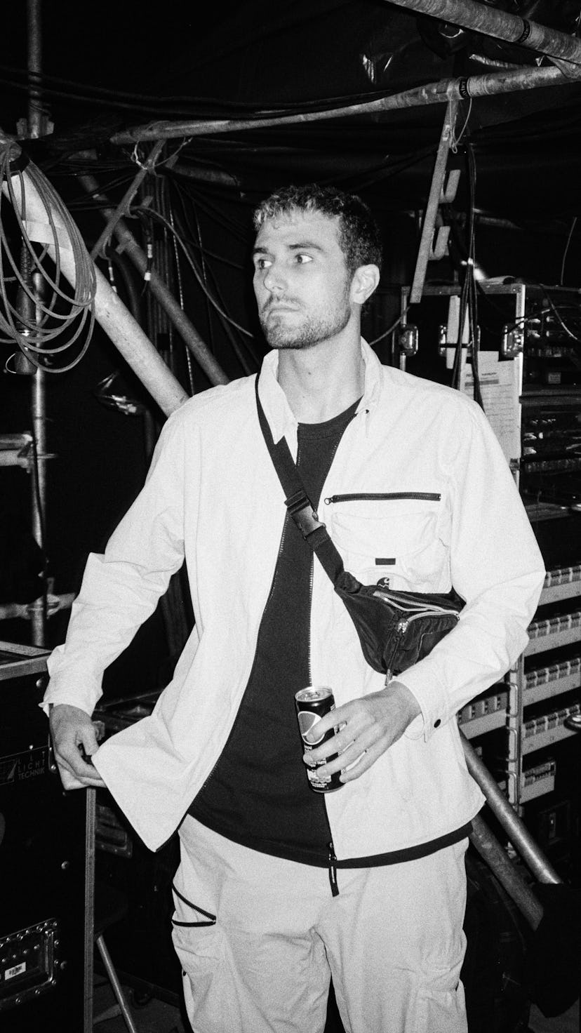 Fred Again backstage at a show in black and white