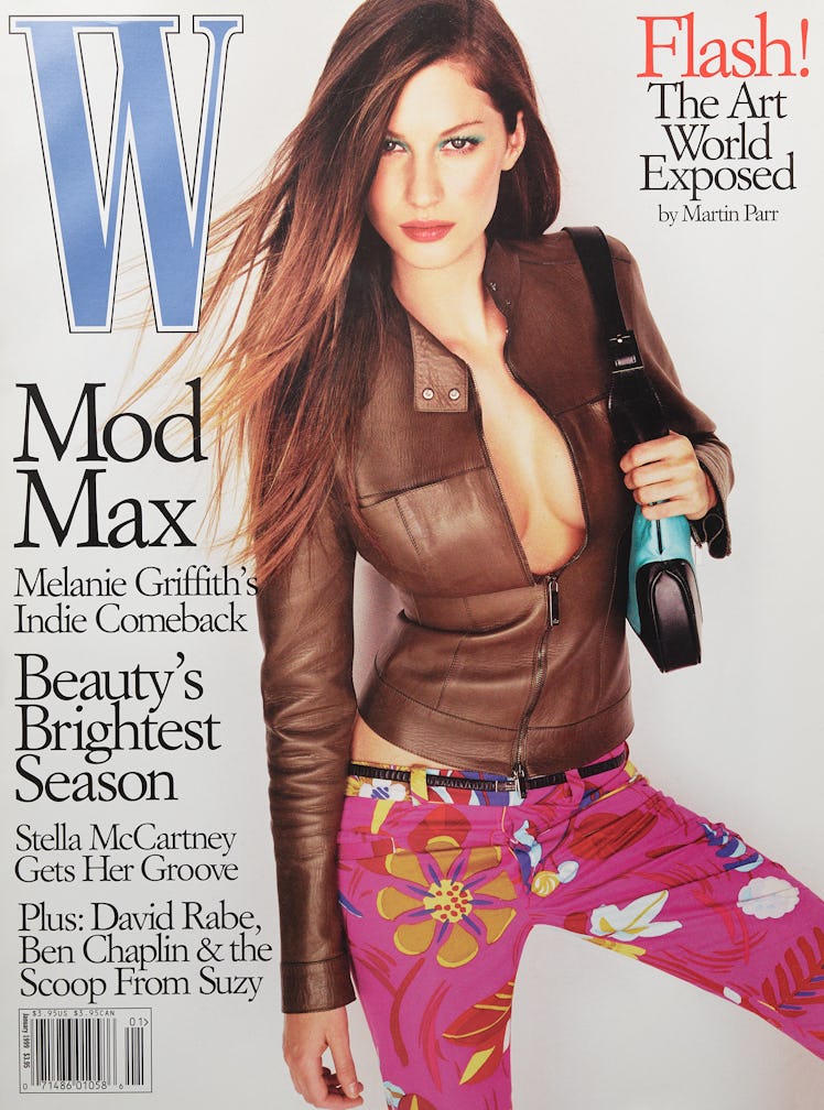 Model Gisele Bundchen in a brown leather jacket and pink floral pants on the cover of W