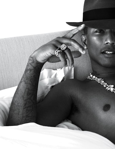 Pharrell Williams laying in bed
