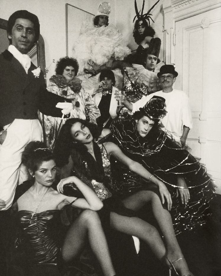 Giancarlo Giammetti at Valentino’s party posing with a group of people