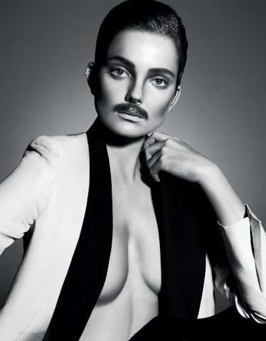 Model Eniko Mihalik wearing a mustache in 'Remodeling the '70s'