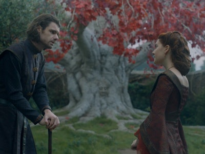 Lord Larys Strong and Queen Alicent Hightower stand near a Weirwood Tree in House of the Dragon Epis...