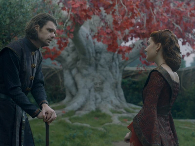 Lord Larys Strong and Queen Alicent Hightower stand near a Weirwood Tree in House of the Dragon Epis...