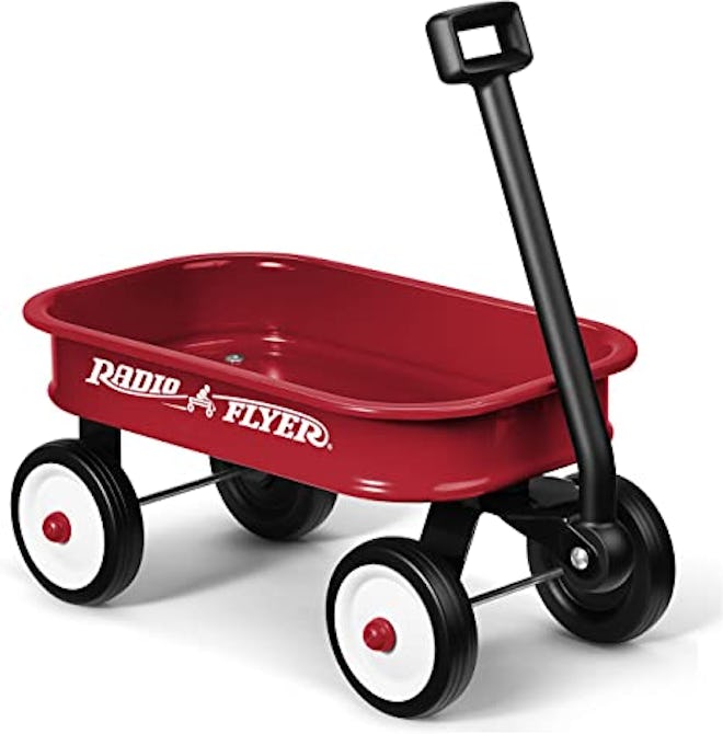 A little red wagon is fun for toddlers to push, pull, load, and unload.