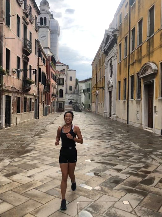 Woman on a marathon training running through the streets of Venice