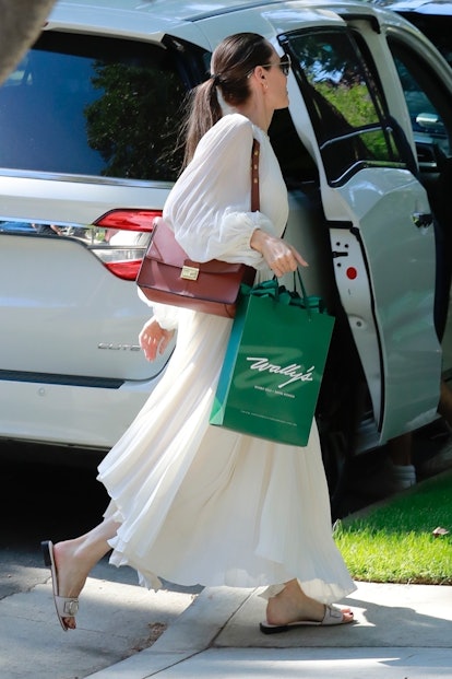 Angelina Jolie wearing Louis Vuitton City Steamer Bag, Ulla Johnson Alice  Dress and Gianvito Rossi Pina