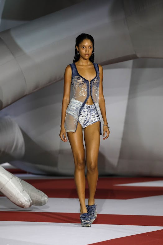 A model in a top and shorts at the Diesel Fashion Show during the Milan Fashion Week Womenswear Spri...