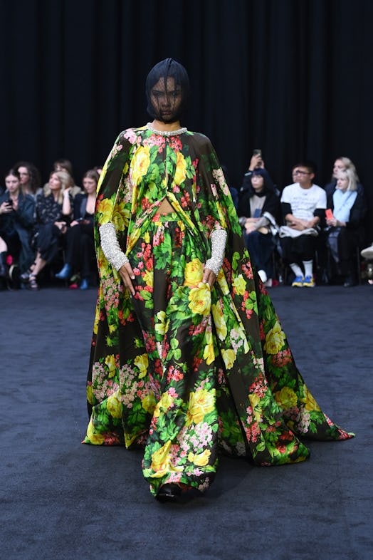 A model wearing Richard Quinn’s two-piece floral vibrant maxi dress tributing Queen Elizabeth II.