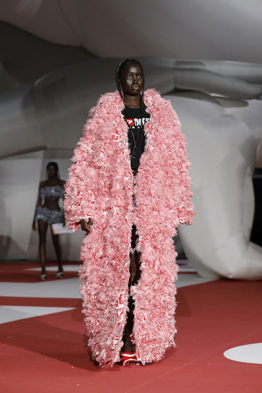 A model in a long pink coat at the Diesel Fashion Show during the Milan Fashion Week Womenswear Spri...