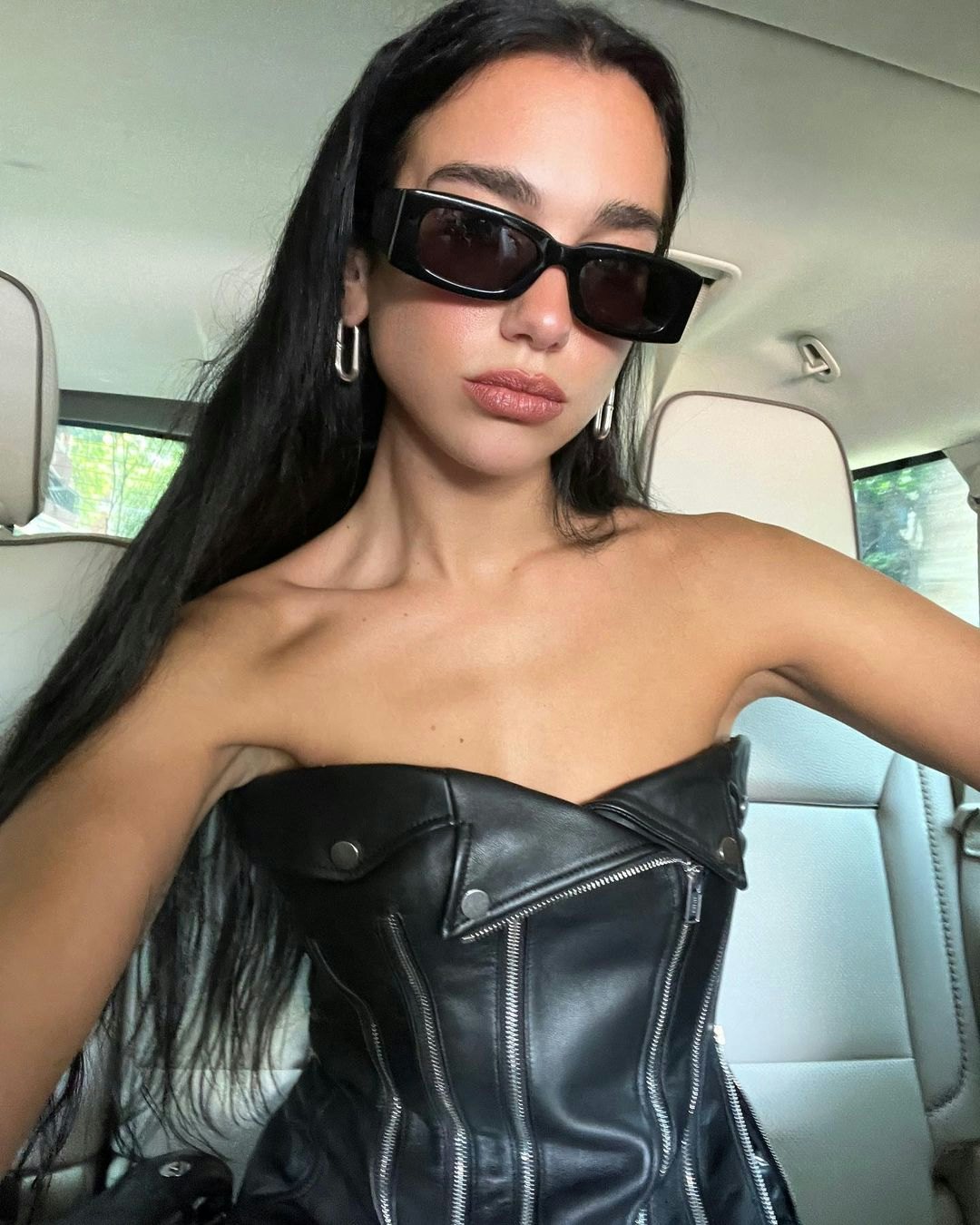 Dua Lipa's black leather strapless top is actually just belts
