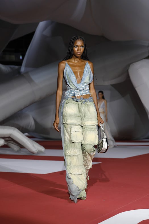 A model in a denim top and pants at the Diesel Fashion Show during the Milan Fashion Week Womenswear...