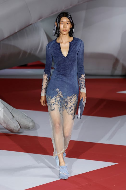 A model in a denim dress at the Diesel Fashion Show during the Milan Fashion Week Womenswear Spring/...