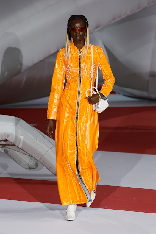 A model in an orange jumpsuit at the Diesel Fashion Show during the Milan Fashion Week Womenswear Sp...
