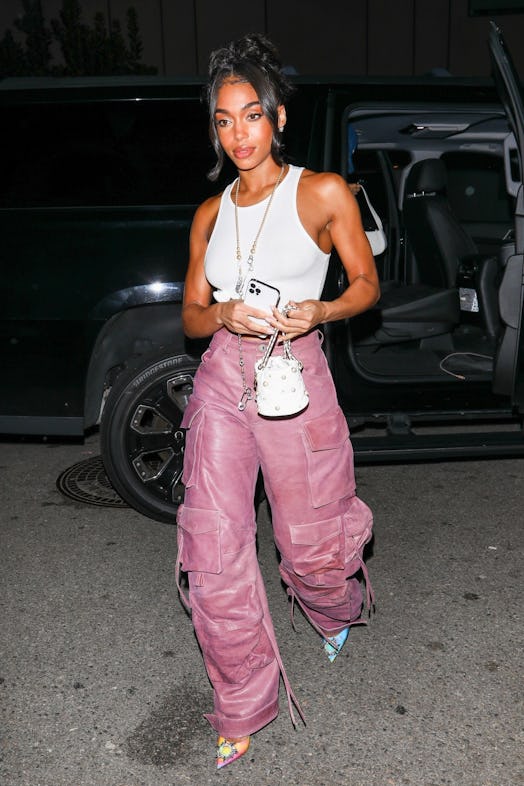 ori Harvey shows off her toned abs while arriving at rapper Jack Harlow's post concert afterparty in...