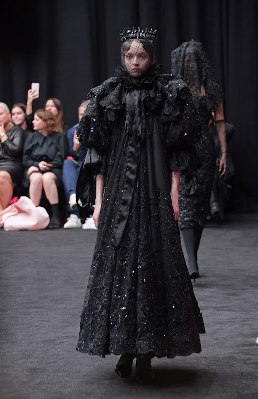 Richard Quinn’s tribute to Queen Elizabeth II via a black dress outfit stylized with the black face ...