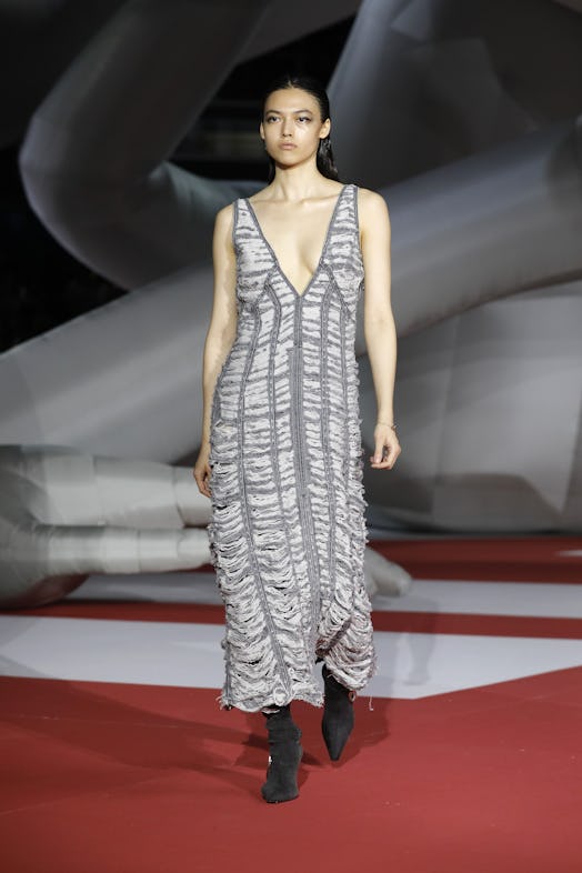 A model in a long grey dress at the Diesel Fashion Show during the Milan Fashion Week Womenswear Spr...