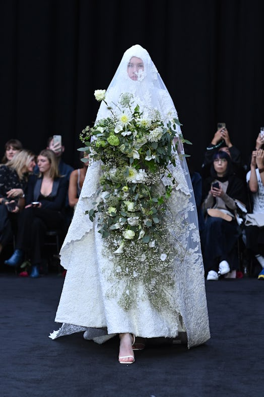 Richard Quinn’s head-to-toe wedding gown with lace details as a tribute to Queen Elizabeth II.