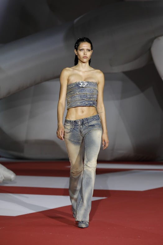  A model in a denim top and pants at the Diesel Fashion Show during the Milan Fashion Week Womenswea...
