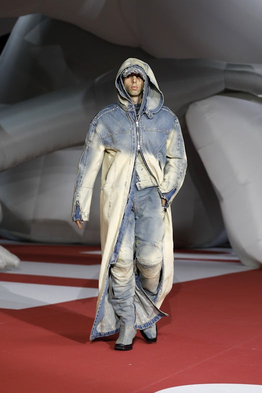  A model in a denim coat and pants at the Diesel Fashion Show during the Milan Fashion Week Womenswe...