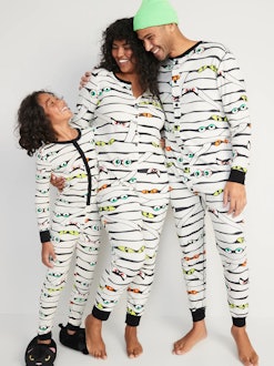 A family wearing matching mummy pajamas from Old Navy, some of the best halloween family pajamas.