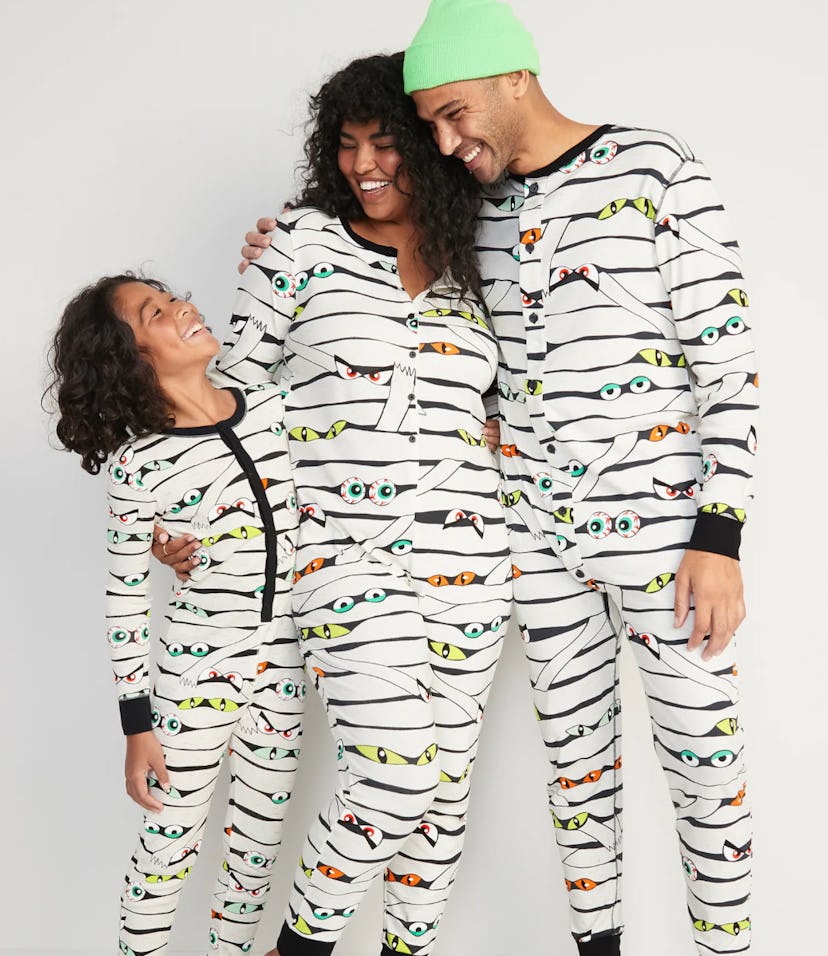 A family wearing matching mummy pajamas from Old Navy, some of the best halloween family pajamas.