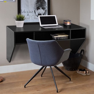 This floating desk has compartments for storage.
