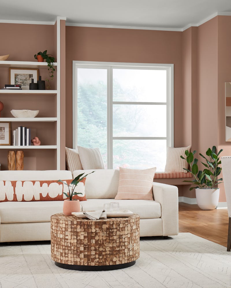 A living room with a couch in the Redend Point color