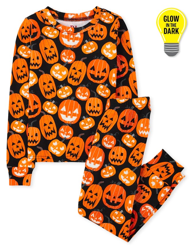 Unisex Kids Matching Family Glow Pumpkin Patch Snug Fit Pajamas are some of the best Halloween famil...