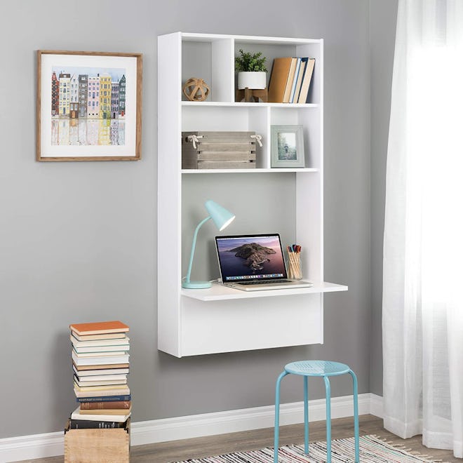 This floating desk has bookshelves that offer storage for office supplies.