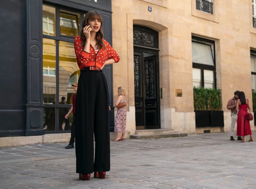 Lily Collins as Emily Cooper with bangs in 'Emily in Paris' season 3.