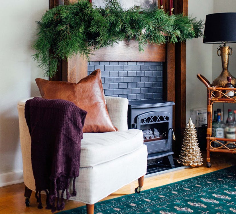 A small living room decorated and cozy for the holidays