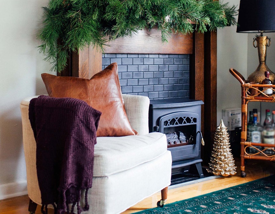 A small living room decorated and cozy for the holidays