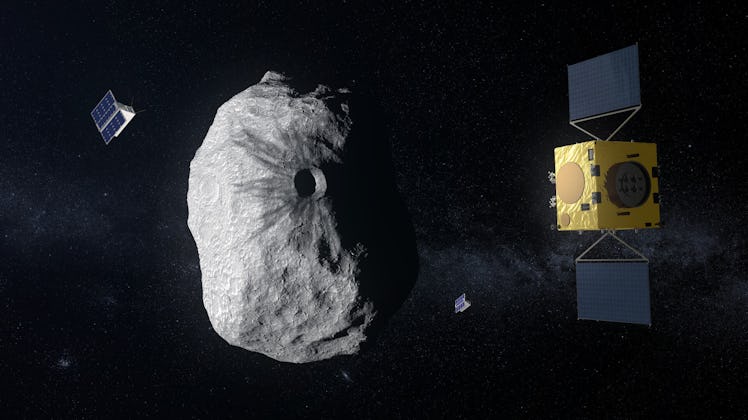 two small spacecraft near an asteroid