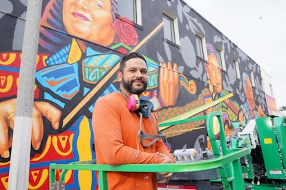 Sergio Rebelto in front of his mural in El Monte, commissioned by SHEIN.