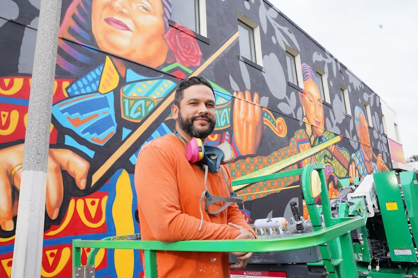 Sergio Robleto in front of his mural in El Monte, commissioned by SHEIN.
