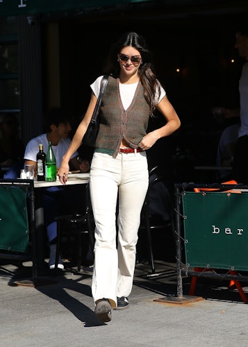 Kendall Jenner Styled White Jeans With A Cozy Knit Vest For Fall
