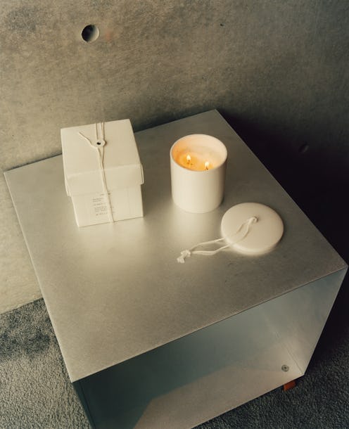 A white box and an unboxed candle from Zara Origins' third collection on a silver table