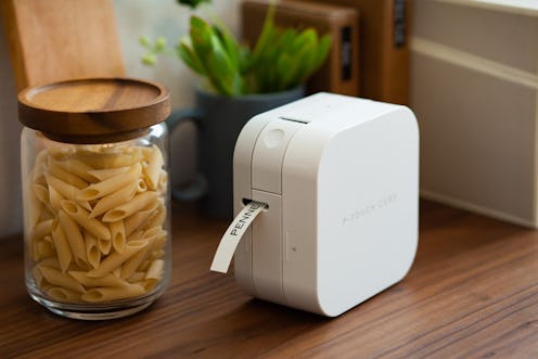 The best Bluetooth label makers, like the Brother device that's sitting next to a jar of pasta and p...