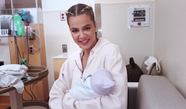 Khloe Kardashian holding her son after his birth via surrogate.